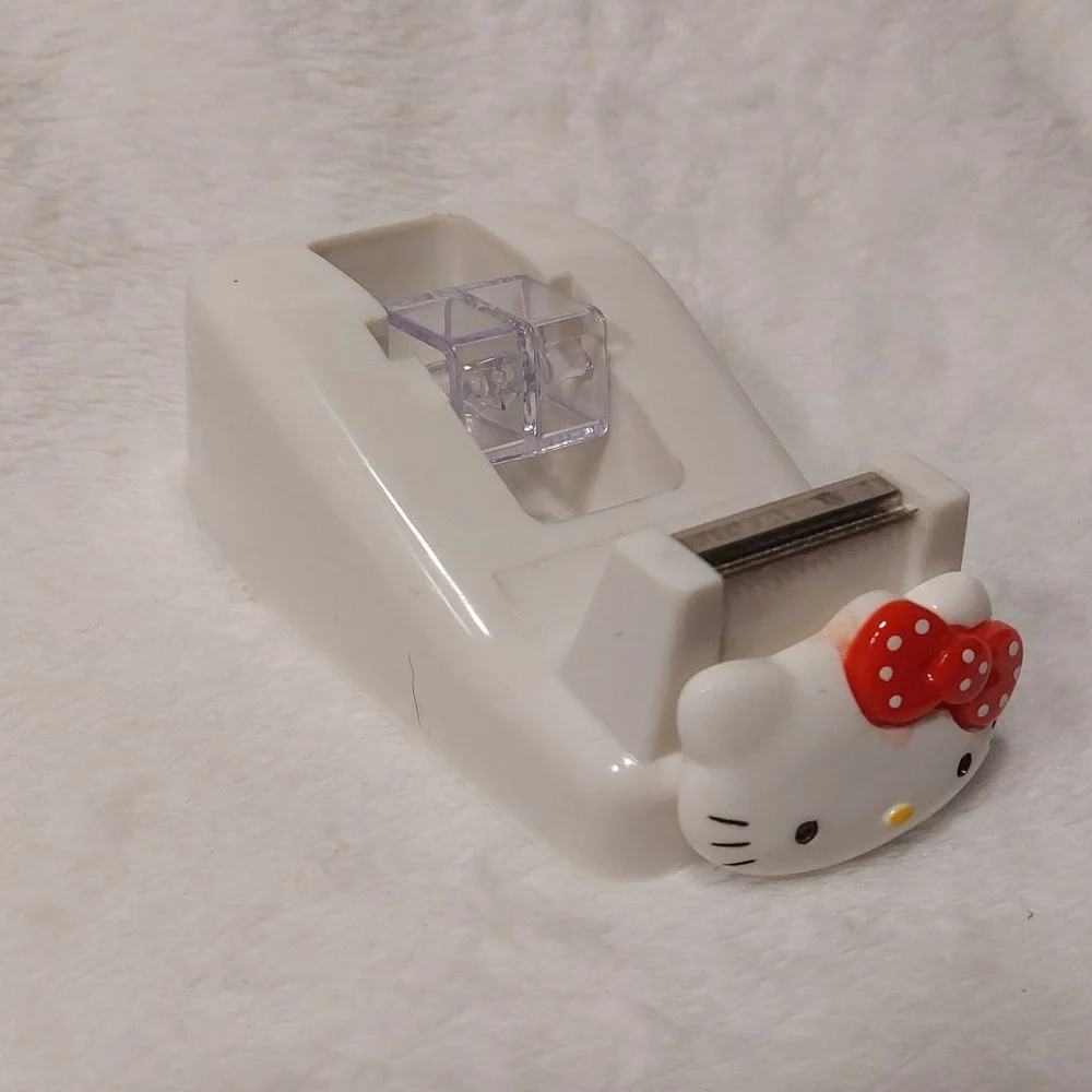 Make projects fun when you use this Hello Kitty White and Red Tape Dispenser